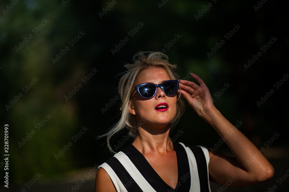 beautiful blonde woman in the autumn forest at sunset beautiful blonde woman in the autumn forest at sunset