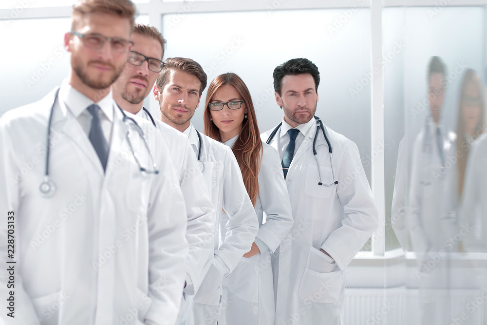 team of doctors standing in the hospital corridor team of doctors standing in the hospital corridor