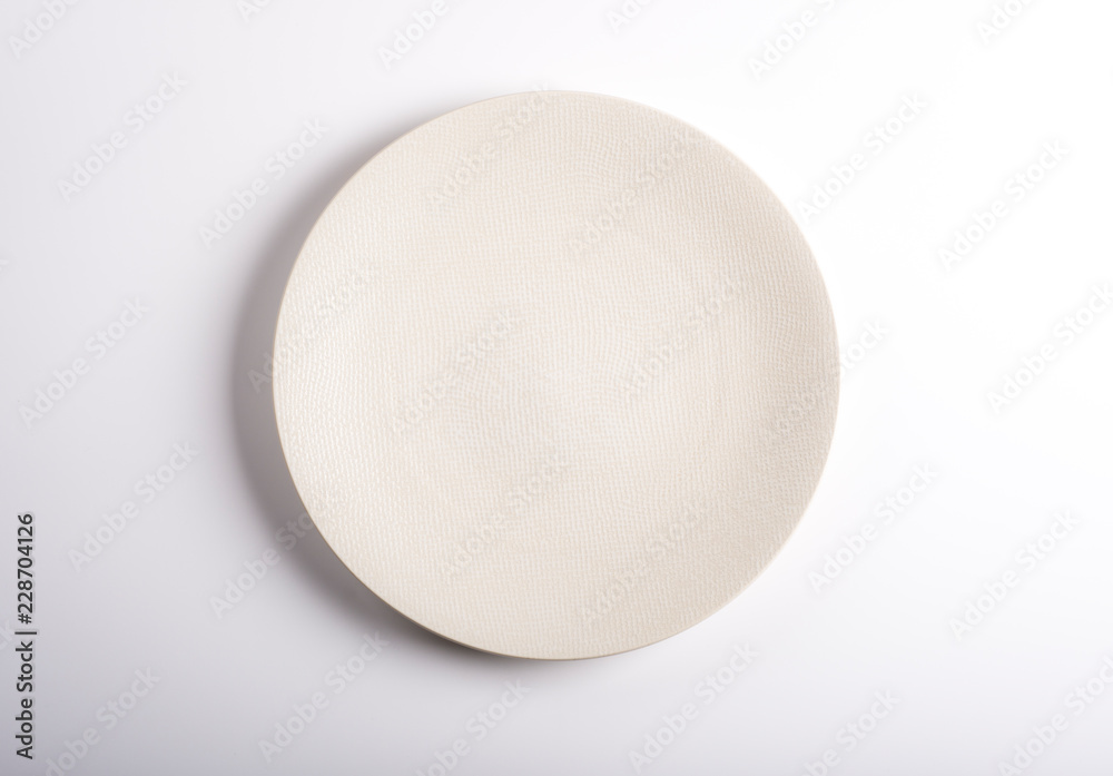 Empty dish isolated on a white background. Top view. Empty dish isolated on a white background. Top view.