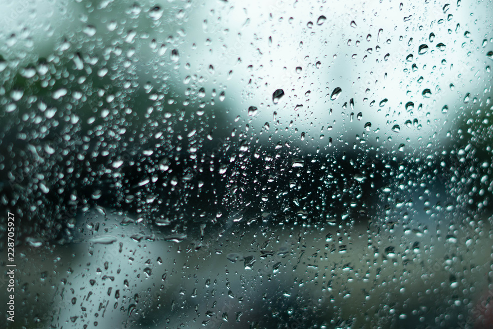 Water droplets on the car glass surface. after the rain fell by the ...