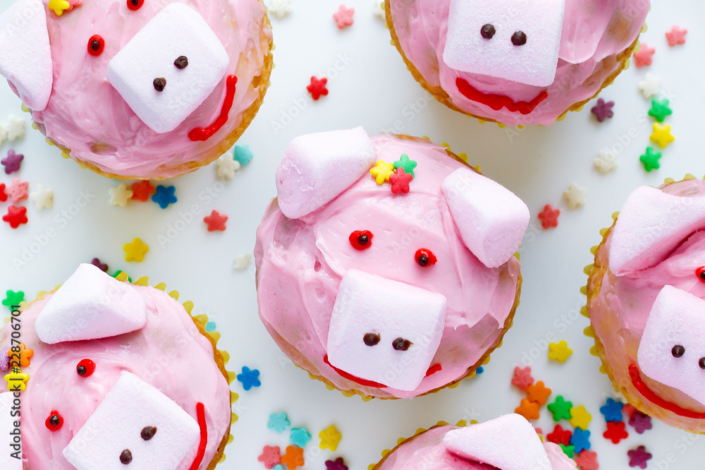 Pink pig cupcakes - homemade cupcakes decorated with cream cheese frosting and marshmallow shaped funny piggies, christmas and new year 2019 sweet treat for kids Pink pig cupcakes - homemade cupcakes decorated with cream cheese frosting and marshmallow shaped funny piggies, christmas and new year 2019 sweet treat for kids