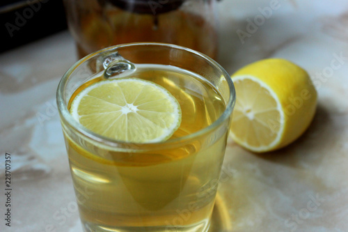 Green tea with lemon in the glass cup
