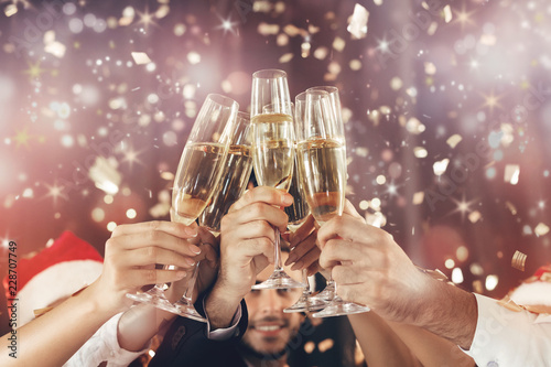 People holding glasses of champagne making a toast photo