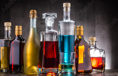 Carafe and bottles of assorted alcoholic beverages.