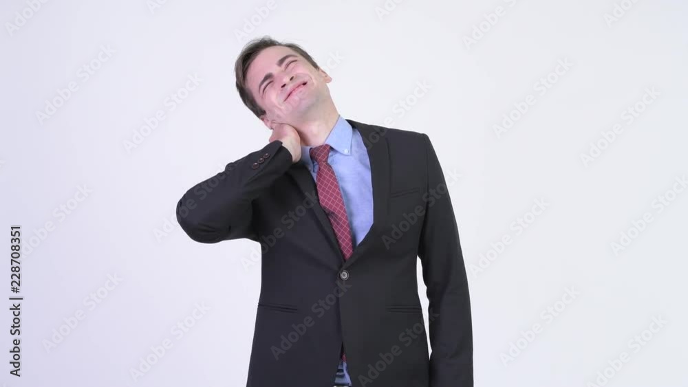 Young stressed businessman having neck pain Young stressed businessman having neck pain