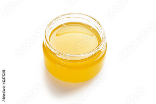 Fresh sweet honey in jar, isolated on white