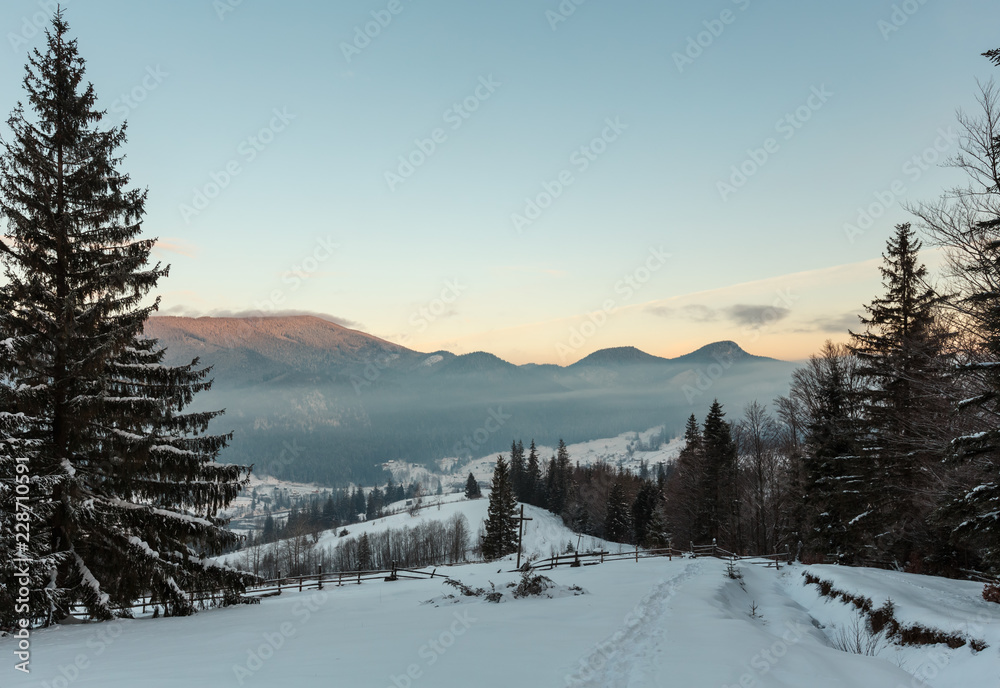 Fototapeta premium Sunrise winter Carpathian mountain village Zelene outskirts, Verkhovyna, Ukraine