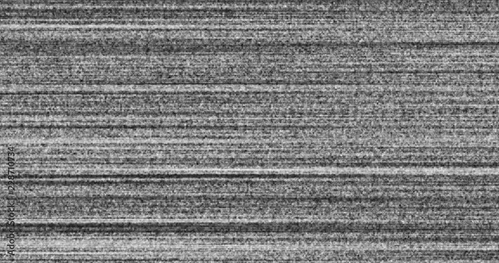 A flickering, analog TV signal with bad interference noise background