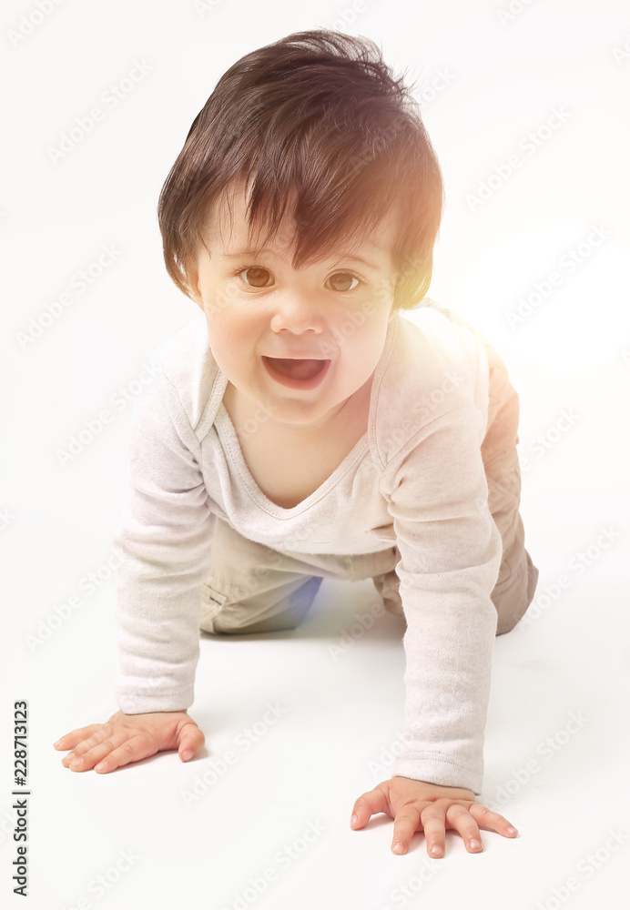 the baby learns to crawl isolated on white background the baby learns to crawl isolated on white background