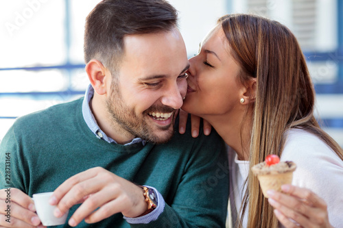 Vászonkép Loving young couple having a great time in a cafe