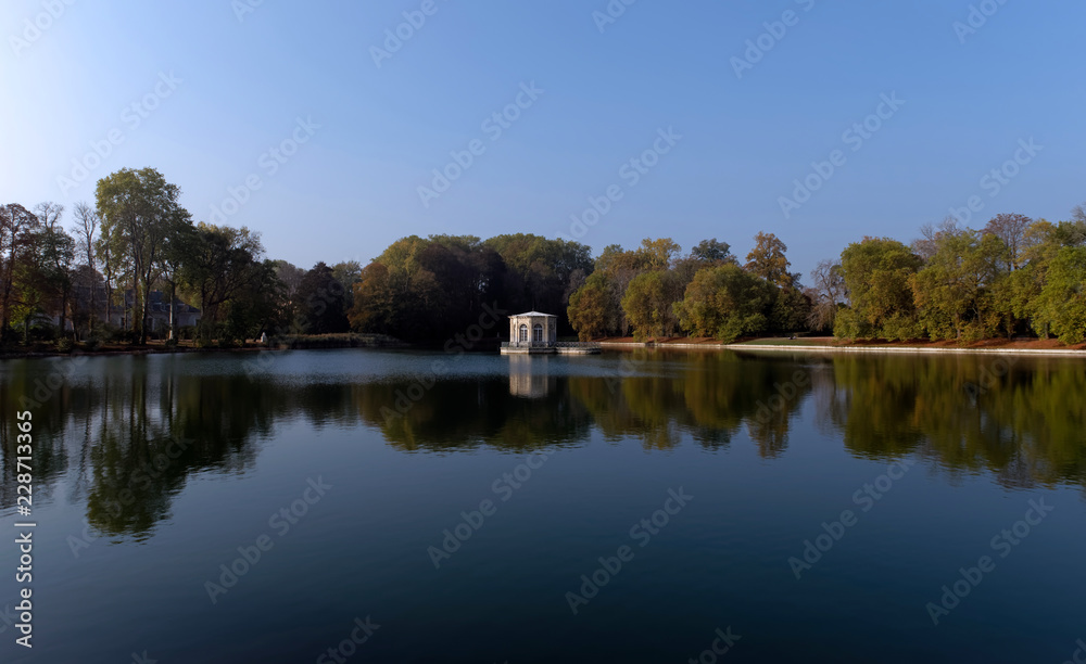 Summerhouse reflection on the carp pond in Fontainebleau 