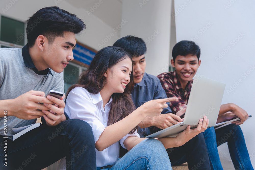 Group of students are sitting talking to exchange knowledge and enjoy learning in the concept and technology of the university. Group of students are sitting talking to exchange knowledge and enjoy learning in the concept and technology of the university.
