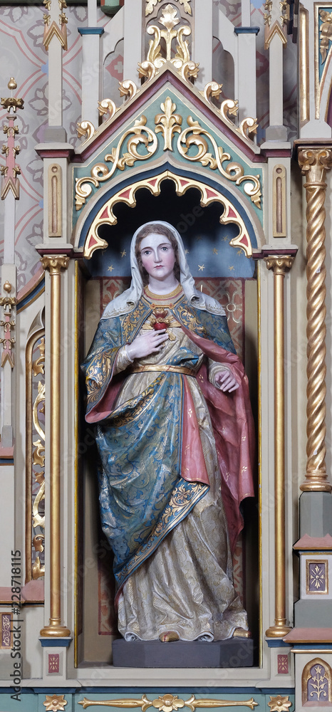 Immaculate heart of Mary statue on the Sacred heart of Jesus altar in the church of Saint Matthew in Stitar, Croatia 