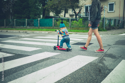 Woman and toddler crossing the road