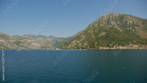 Picturesque view of the waters of the Bayntains rising in the background. One of the most popular Turkish resorts of Montenegro is often visited by tourists due to beautiful views and historic cities.