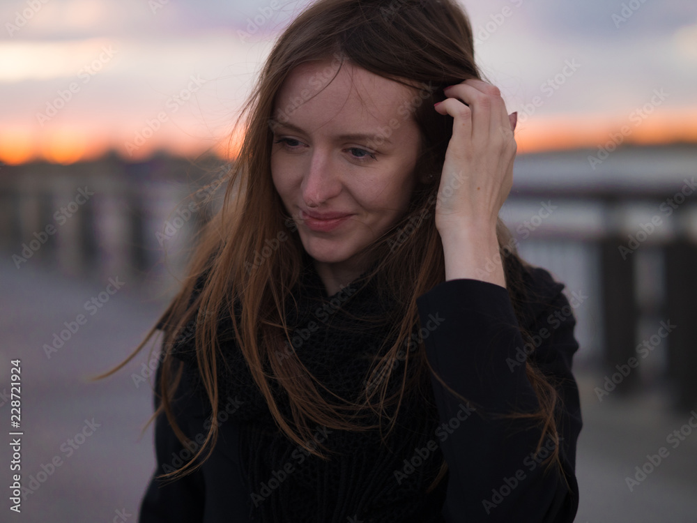 Sunset portrait of beautiful girl. Winded, Blur background. Sunset portrait of beautiful girl. Winded, Blur background.