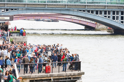 Big crowd of tourists on London's South Bank. photo