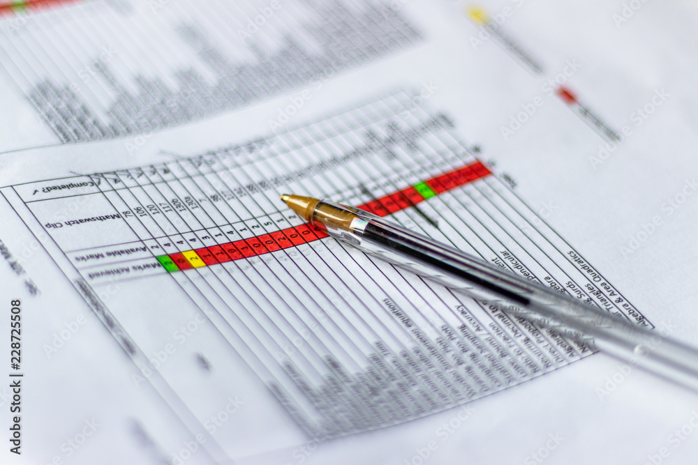 Open Black Pen on data/analysis/finance/document/sheet of paper. Close-up