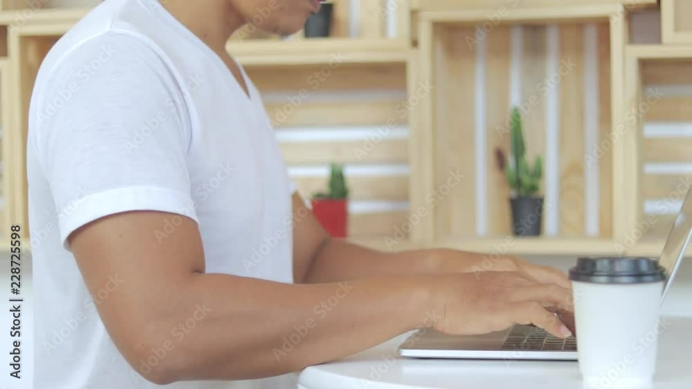 Men are using the notebook to connect to Internet. Men are using the notebook to connect to Internet.