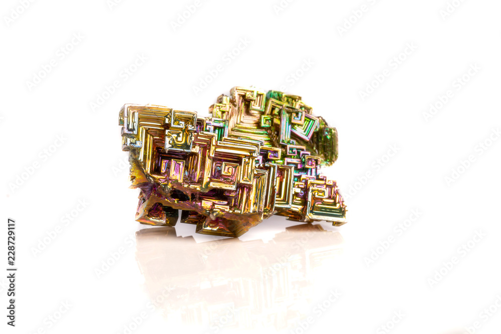 Obraz premium Macro of the mineral bismuth stone on a white background