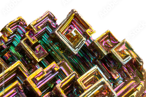 Macro of the mineral bismuth stone on a white background