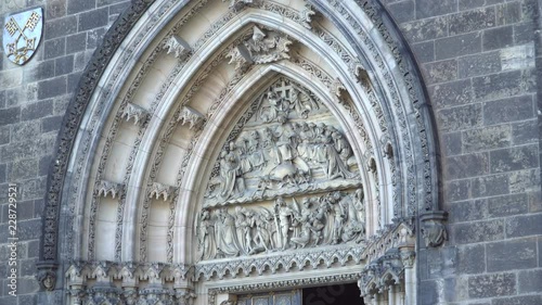 Prague, Czech Republic, September 2018: Catholic Capitol Church in Vyšehrad Prague. Basilica of Saints Peter and Paul. Tympanum above the main entrance to the Basilica photo