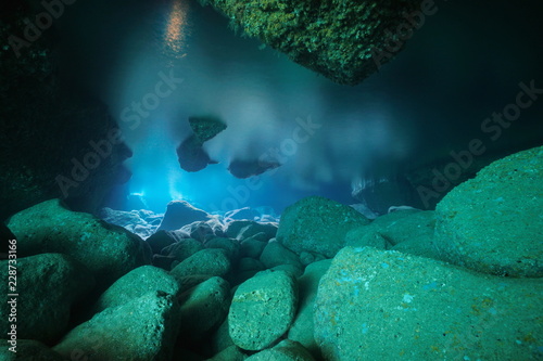 Rocks underwater inside a shallow cave in the Mediterranean sea, natural light, Costa Brava, Spain © dam