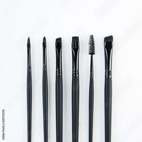 Brush brow and makeup artist in the set. Cut Bon and minimalism. Set of brushes and Flatley. Sterilization of instruments.
