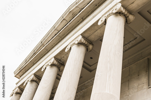 Upward View of Grecian-Style Stone Pillars