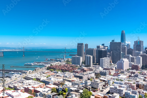San Francisco, panorama of Financial District downtown and the Oakland Bay Bridge in background 
