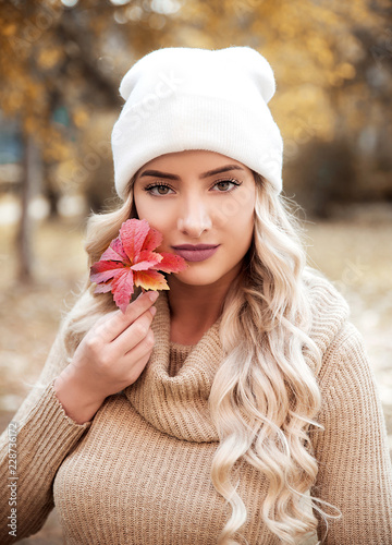 Young woman holding leaves autumn portrait