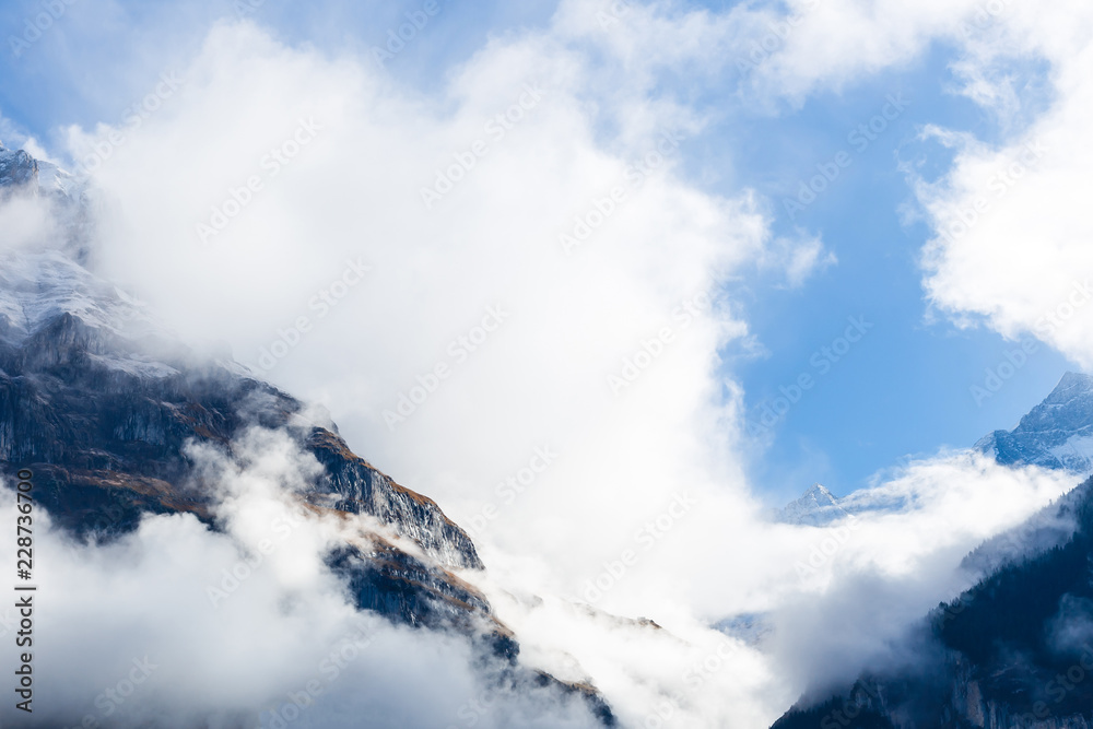 The Swiss Alps against moody clouds above The Swiss Alps against moody clouds above