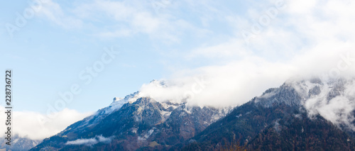 Panoramic view of the Swiss Alps against moody clouds above