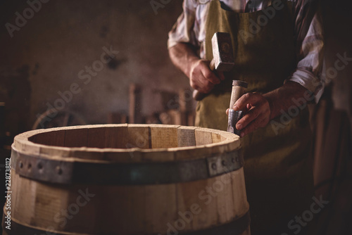 Wooden Barrels in a cooperage, barrel workshop photo