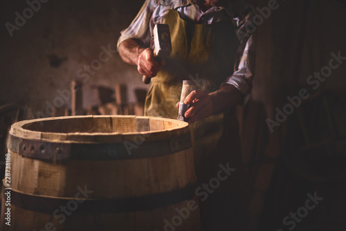 Wooden Barrels in a cooperage, barrel workshop photo