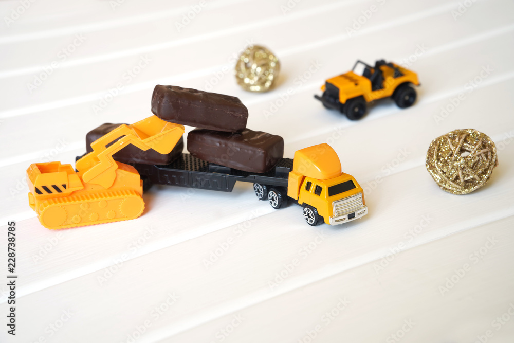 A toy truck is loaded with candy to take to the children for a holiday