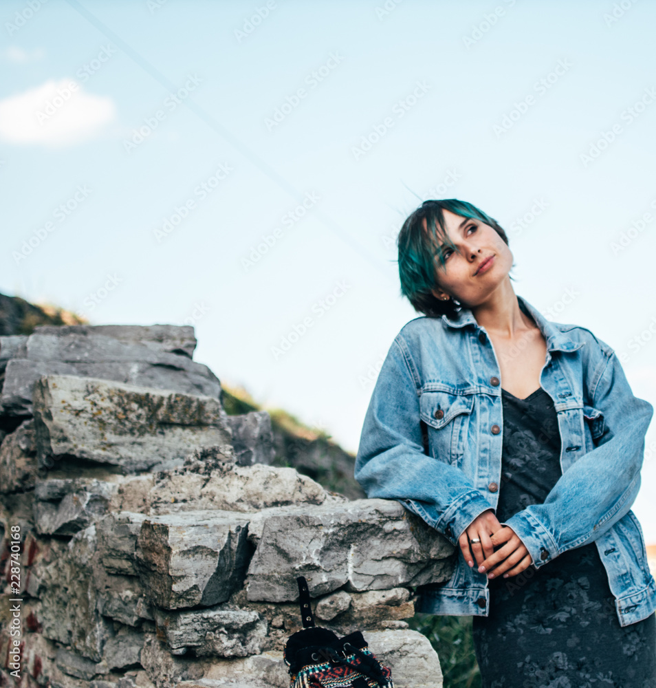 A young woman enjoys a walk through the old historic town. A young woman enjoys a walk through the old historic town.
