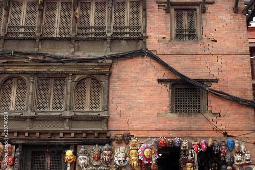 Translation: Local sellers, tourists, and pilgrims at Swayambhunath or Monkey Temple in Kathmandu photo