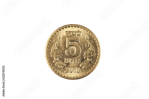 An extreme close up of an Indian five rupee coin on a solid white background