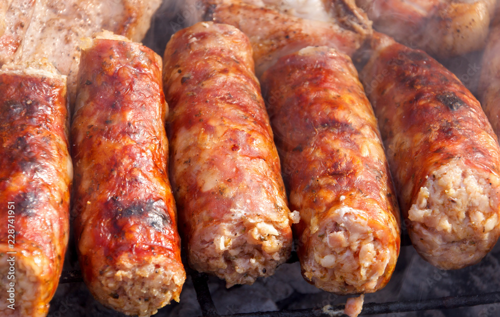 Close up of sausages on barbecue Close up of sausages on barbecue