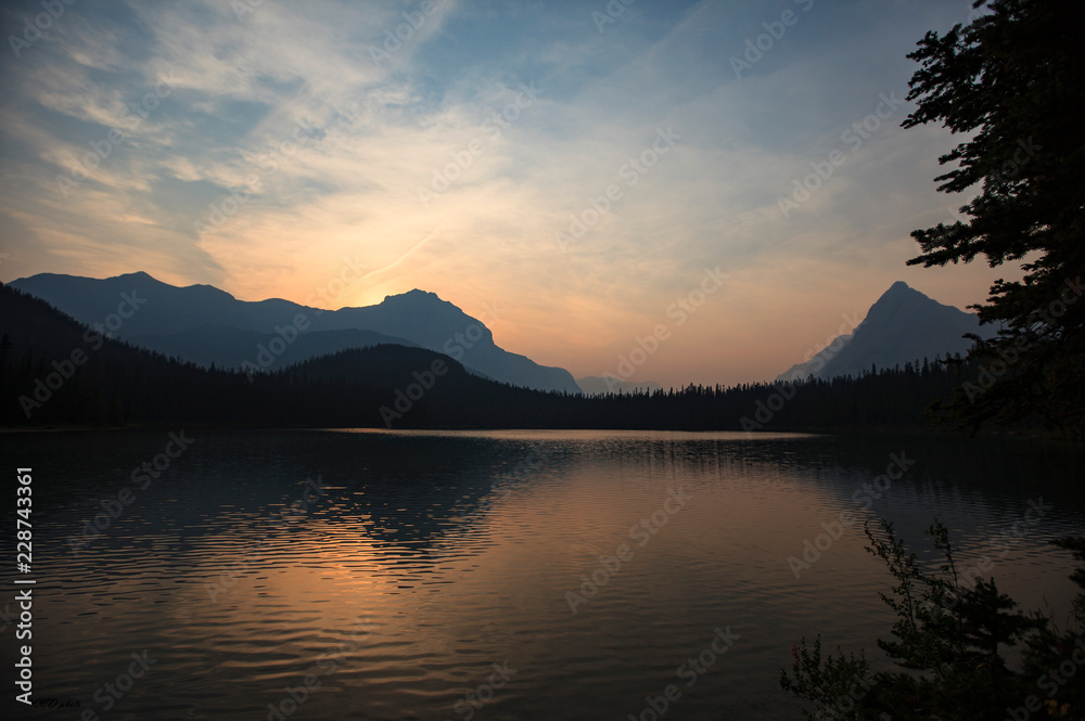 Mountain lake reflections at sunset