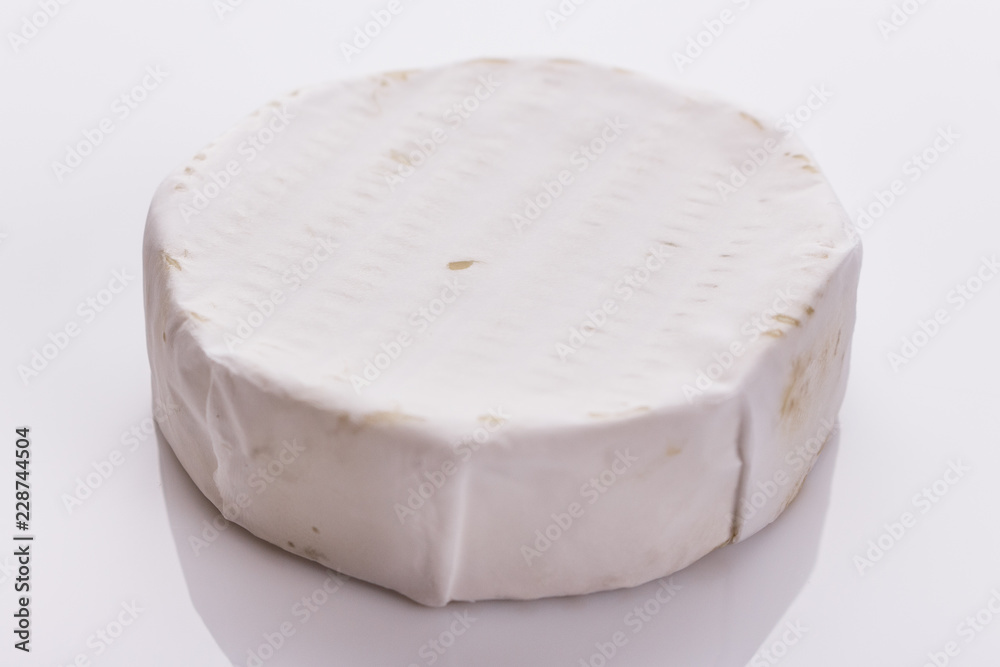 delicious creamy camembert cheese on a white background