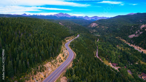 Open Road Pine Trees in Rocky Mountains © Nicholas J. Klein