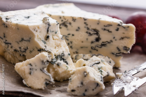 delicious blue cheese on wooden rustic background