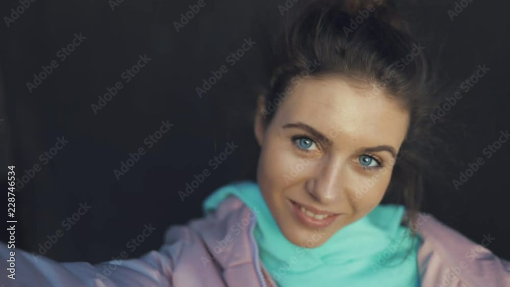 Selfie of funny attractive female model girl smiling. Urban city lifestyle. Slow motion video Selfie of funny attractive female model girl smiling. Urban city lifestyle. Slow motion video