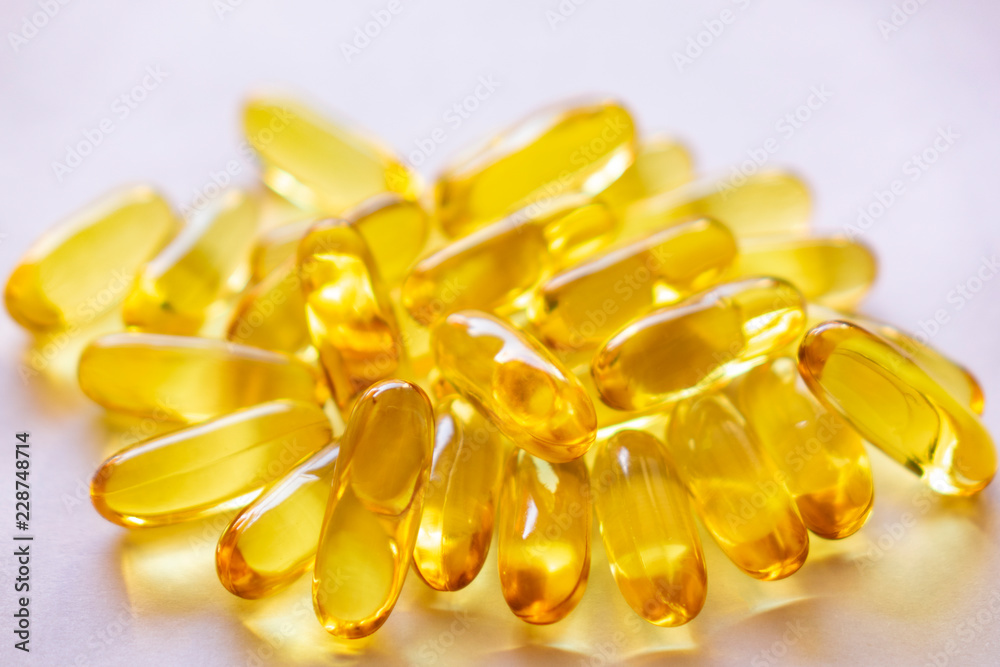 Close up of capsules Omega 3 on white background. Copy space for your text. Top view, high resolution product. Health care concept