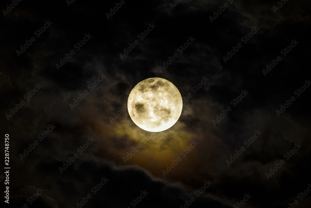 Full Moon Rising Behind Dark Clouds Full Moon Rising Behind Dark Clouds