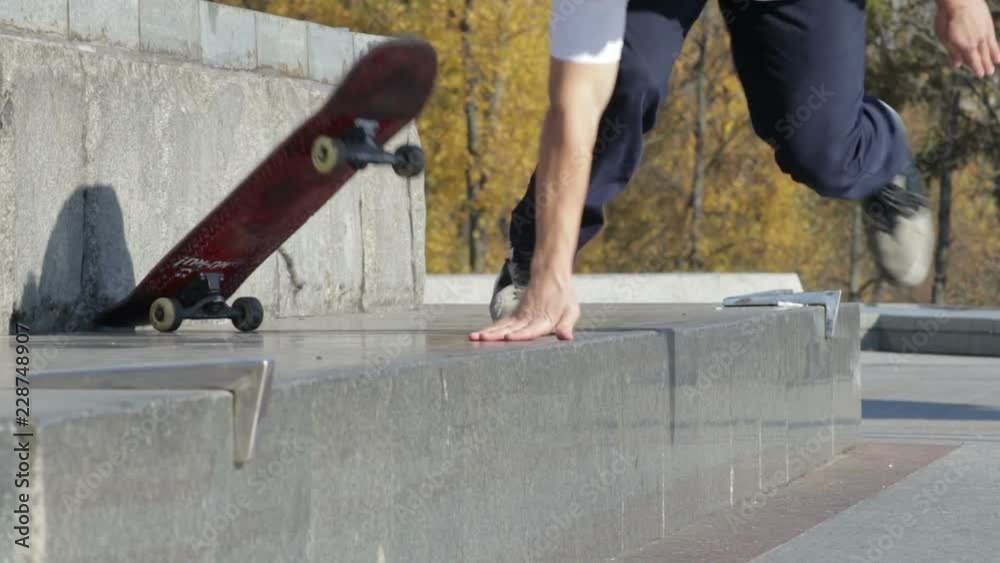 Skateboarder try a grind trick on ledge and falling down, slowmotion Skateboarder try a grind trick on ledge and falling down, slowmotion