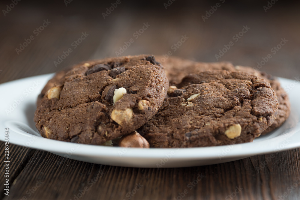 Fototapeta premium Soft dark chocolate brownie cookies on wood