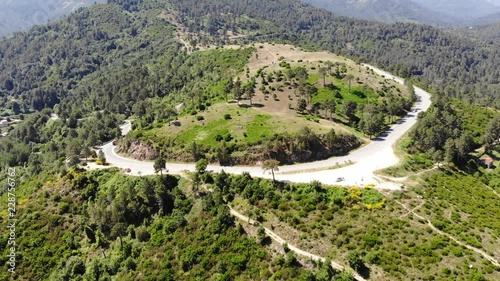 Aerial Drone Footage of a Road Crossing a Mountain in Corsica, France